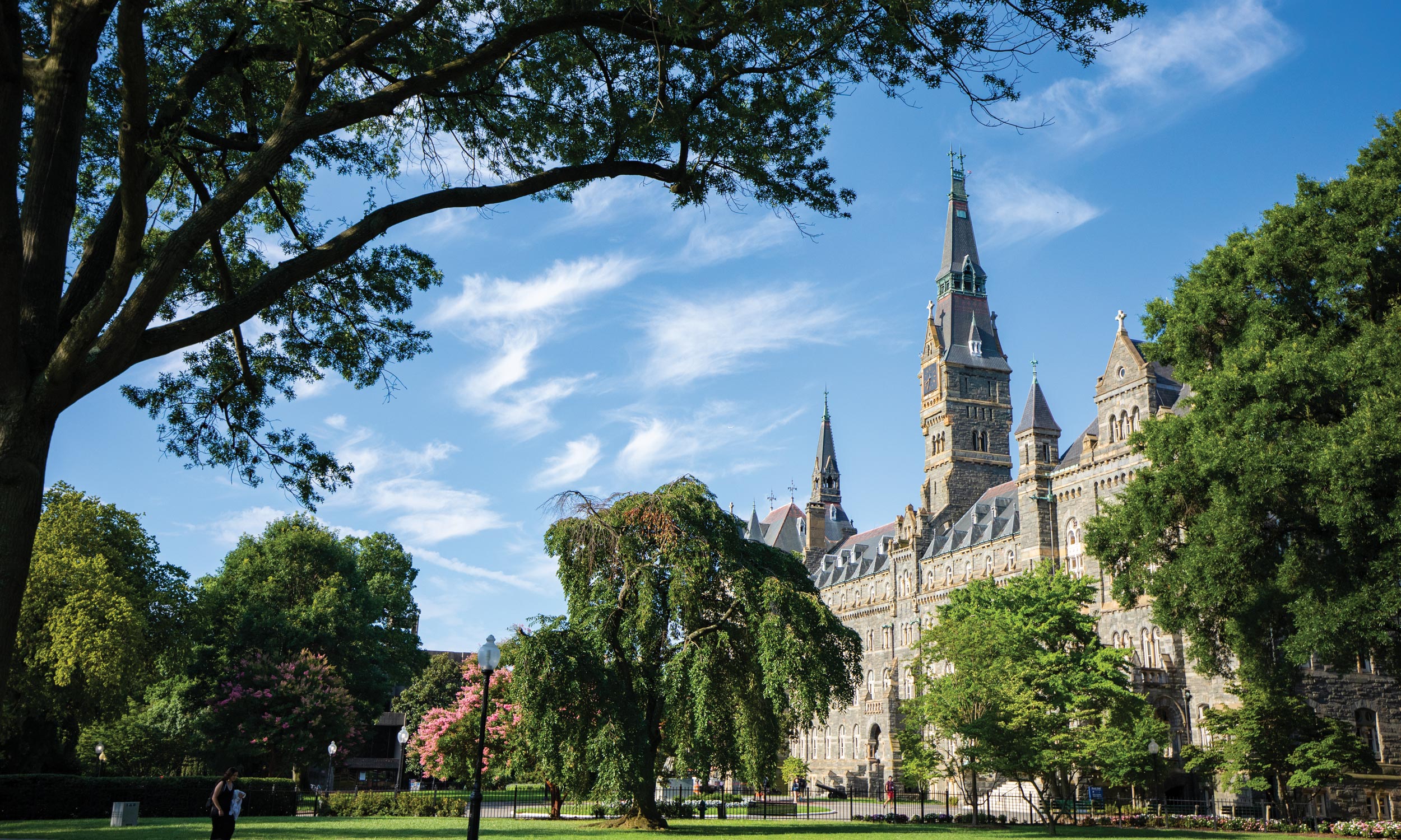 Georgetown campus in the bright summer morning, green trees and view of Healey Hall
