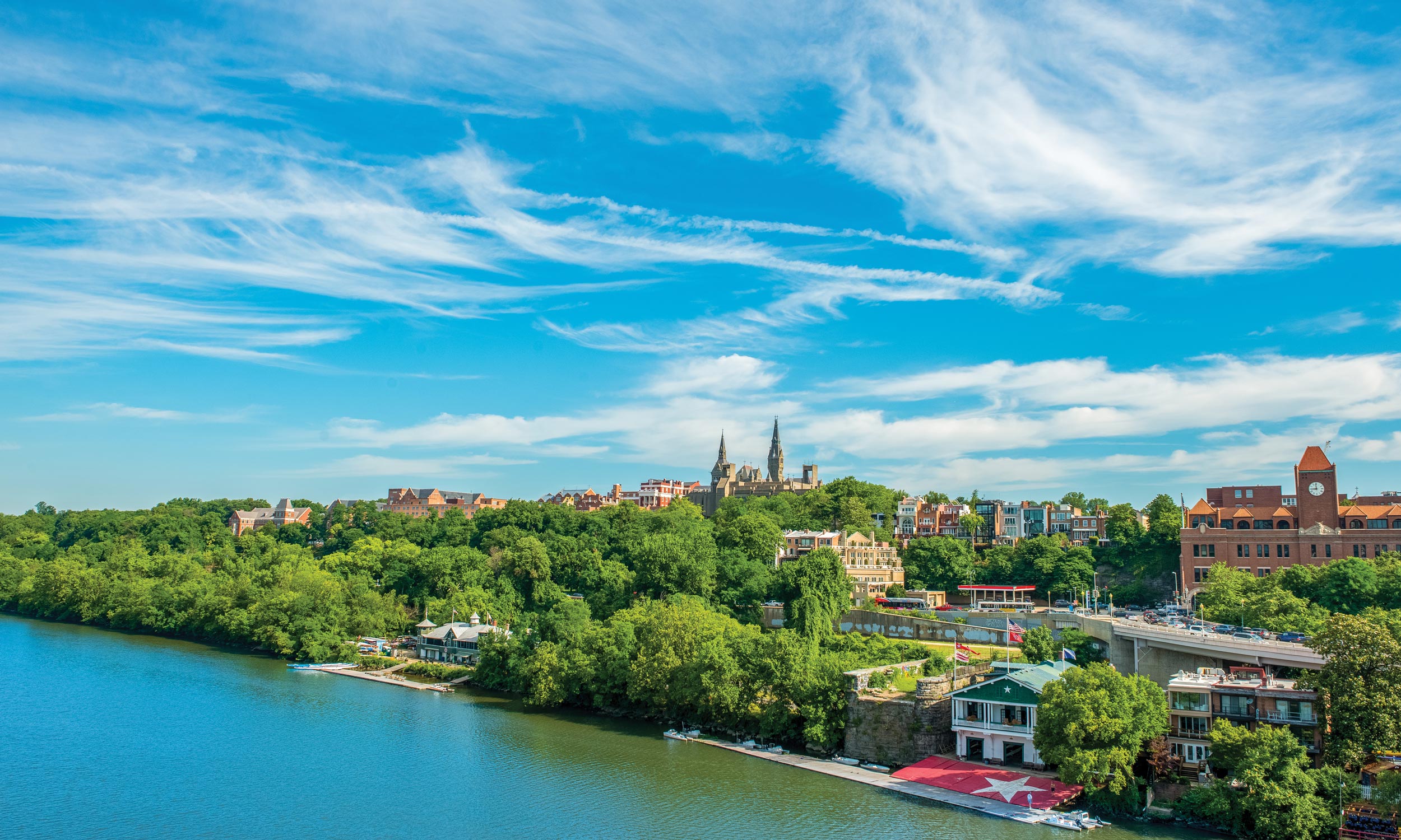 Georgetown neighborhood from an aerial view in the summer, with campus at the top of the hill